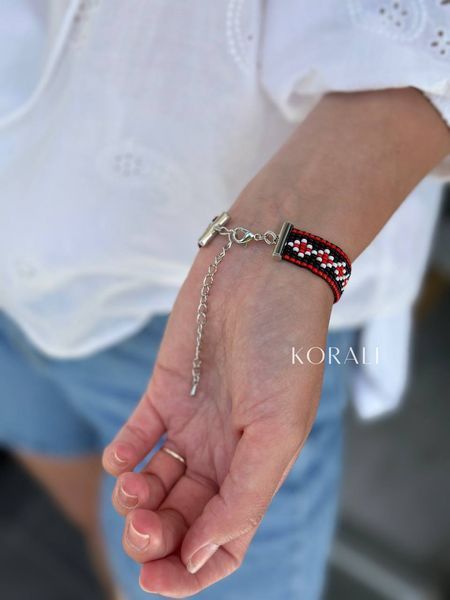 "Embroidered" bracelet is silver with red and black splashes 443 photo