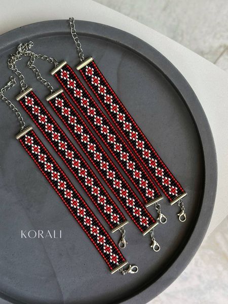 "Embroidered" bracelet is silver with red and black splashes 443 photo