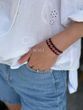"Embroidered" bracelet is silver with red and black splashes 443 photo