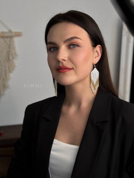 The earrings are white with gold sprinkles 463 photo