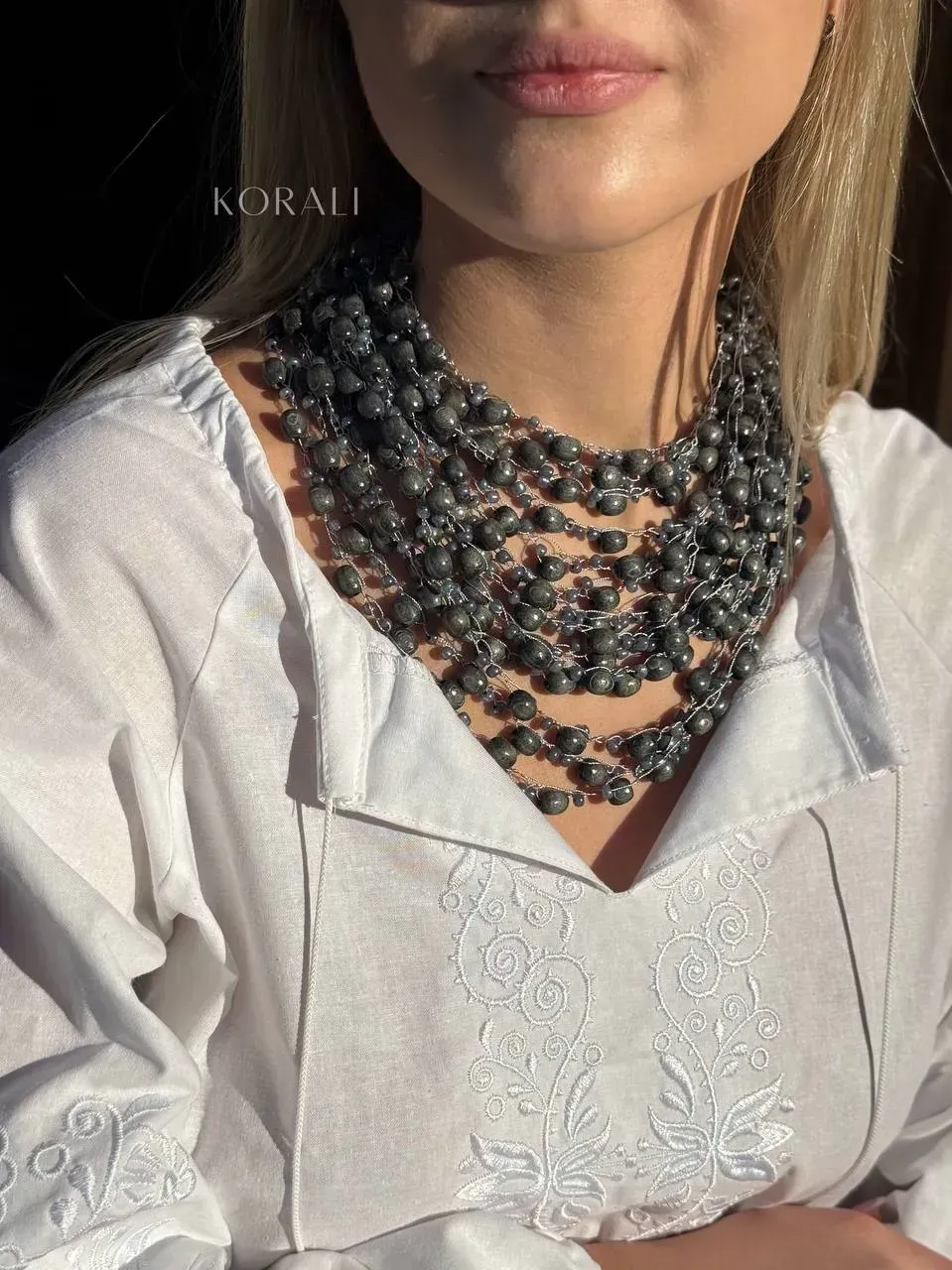 Wooden necklace "Okrasa" gray color review on a girl