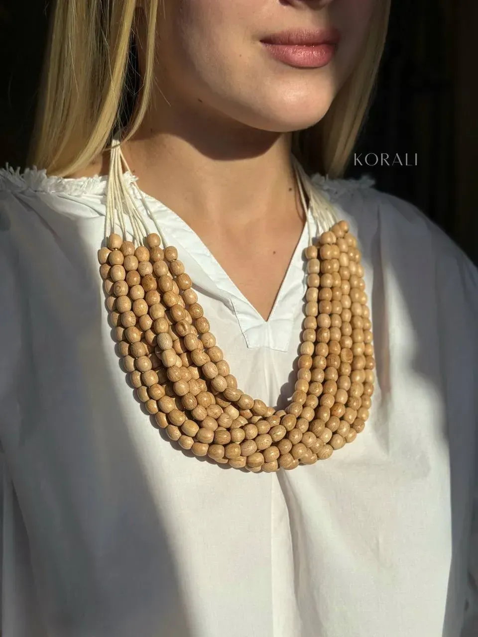 Wooden necklace "Rowbush" beige color review on a girl