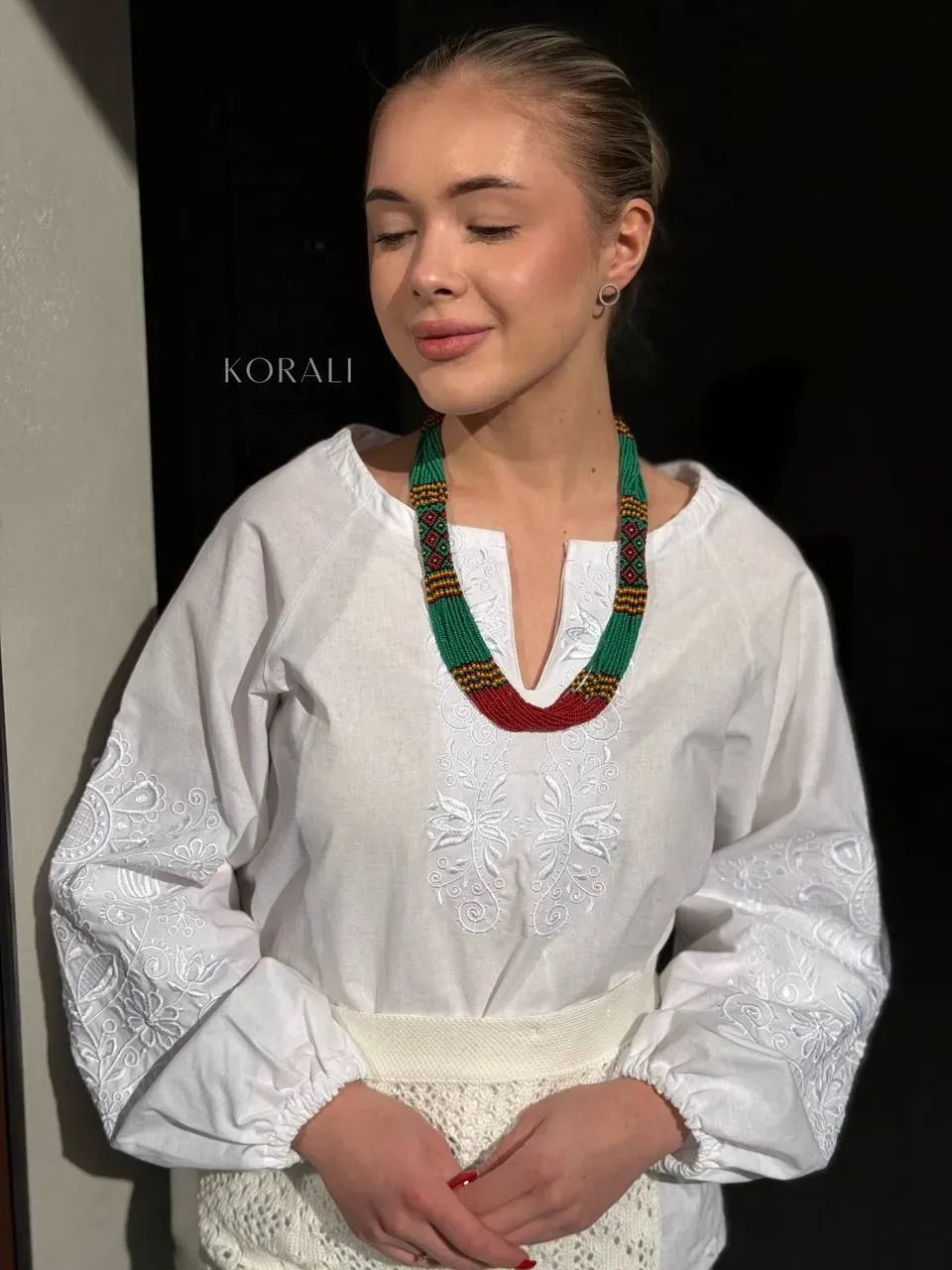 Green ethnic necklace on a girl